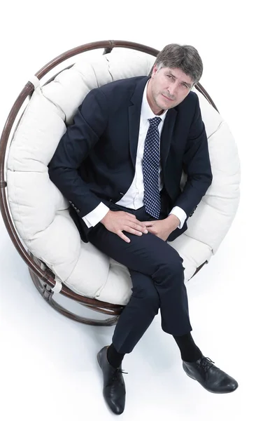 Bovenaanzicht van succesvolle zakenman in comfortabele stoel zitten — Stockfoto