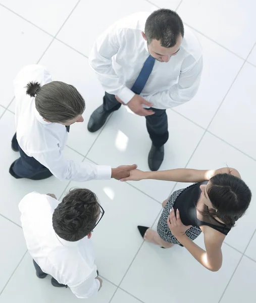 View from the top.welcome colleagues shaking hands in office — Stock Photo, Image