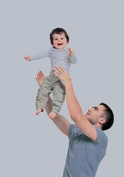 Joyful father giving piggyback ride to his son against a white b — Stock Photo, Image