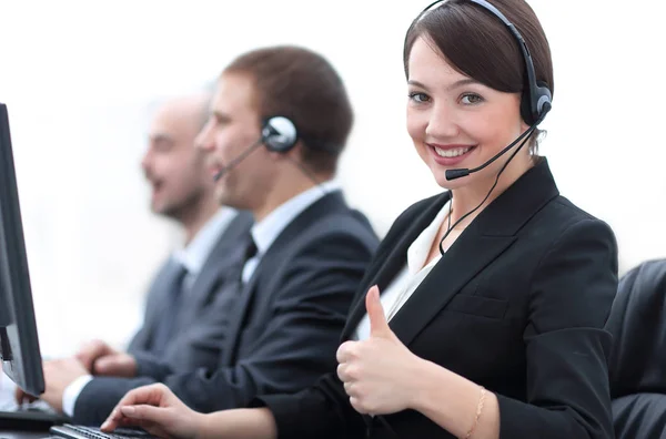 Manager of the call centre shows thumb up sitting at your Desk — Stock Photo, Image