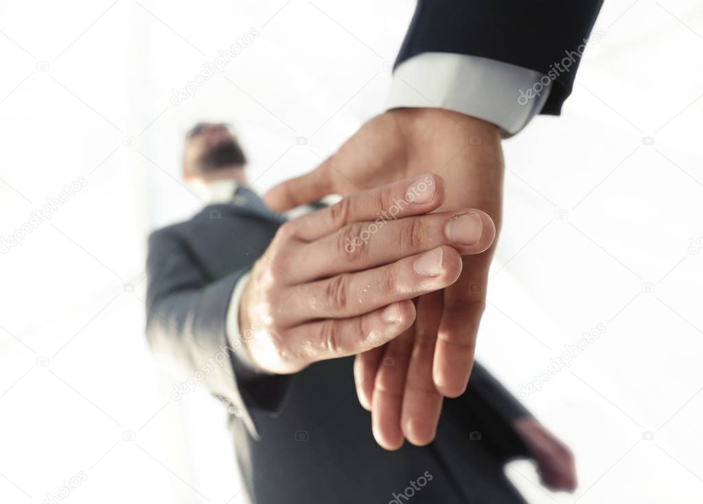 Two  business men going to make handshake