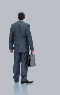 Bir işadamı bir kahverengi gri iş elbiseli arkadan görünüş