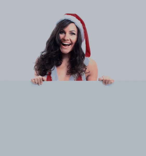 Hermosa mujer de Navidad en Santa Sombrero sosteniendo tablero vacío —  Fotos de Stock
