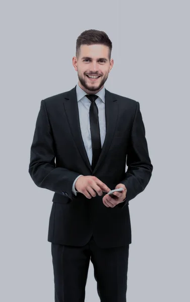 Hombre de negocios guapo en traje usando el teléfono en la oficina —  Fotos de Stock
