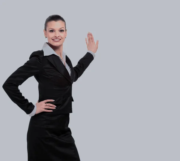 Mujer de negocios señala para anunciar en la pared — Foto de Stock