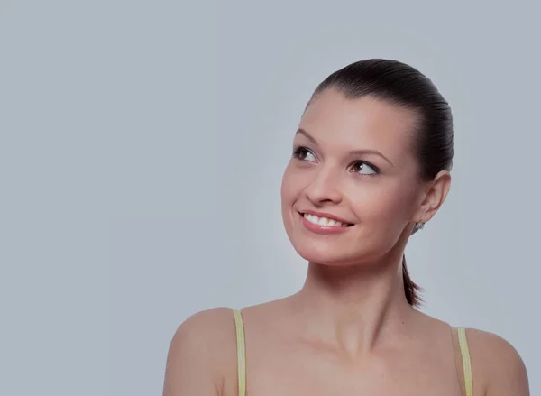 Jonge vrouw op zoek weg geïsoleerd op wit — Stockfoto