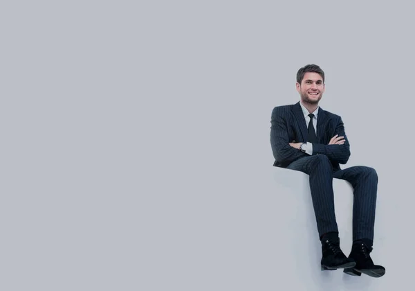 Bello giovane uomo d'affari seduto su un top bianco — Foto Stock