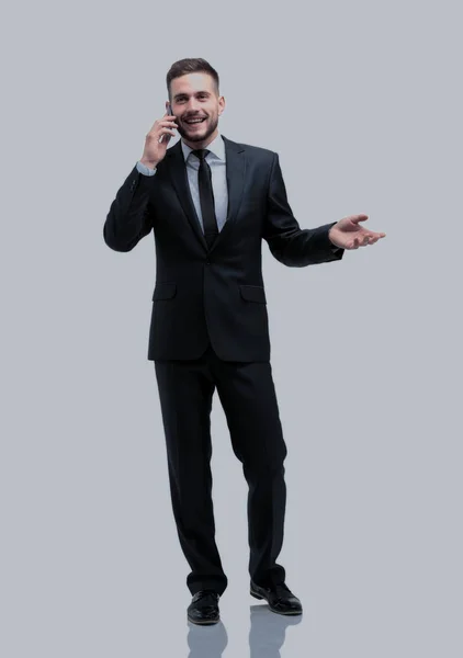 Handsome businessman in suit using the phone in office — Stock Photo, Image