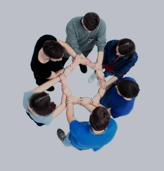 Top view of young people with their hands together in a circle. — Stock Photo, Image