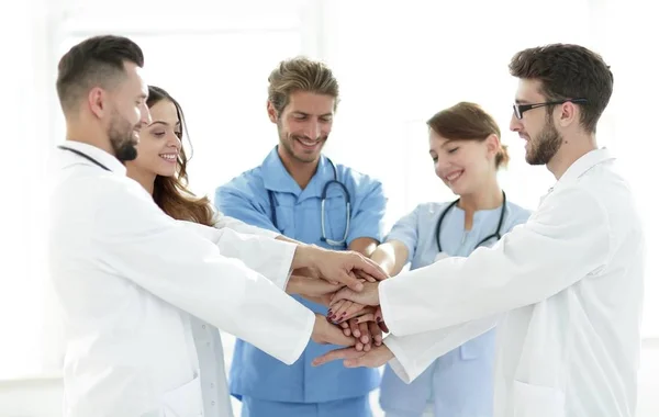 Doctors and nurses stacking hands. concept of mutual aid. — Stock Photo, Image