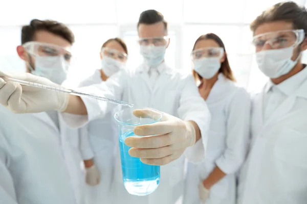 Closeup of a group of medical workers working with liquids — Stock Photo, Image