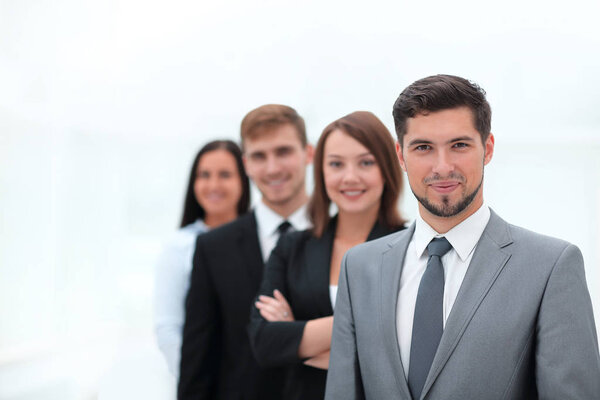 leader and the business team standing one behind the other.