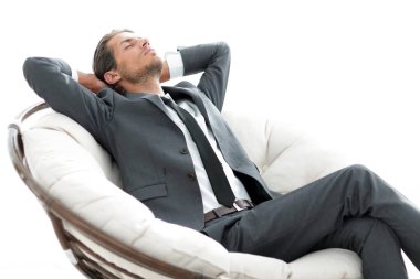 genç işadamı büyük rahat koltukta, meditasyon