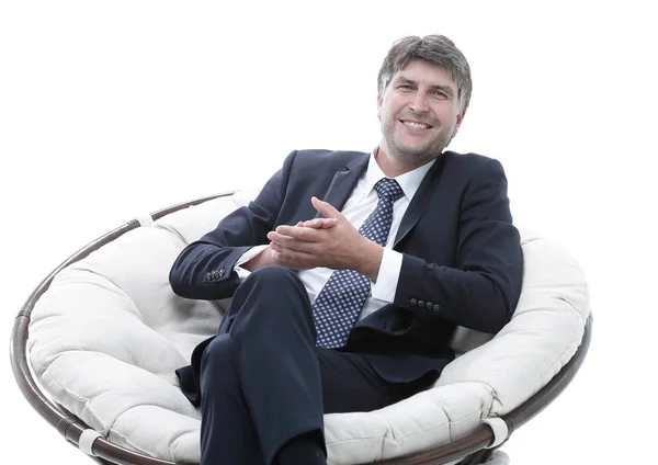 Uomo d'affari di successo siede in una sedia morbida e confortevole . — Foto Stock