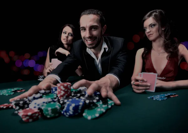 Poker player going "all in" pushing his chips forward — Stock Photo, Image