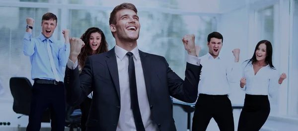Victory in business. jubilant businessman and  team on o — Stock Photo, Image