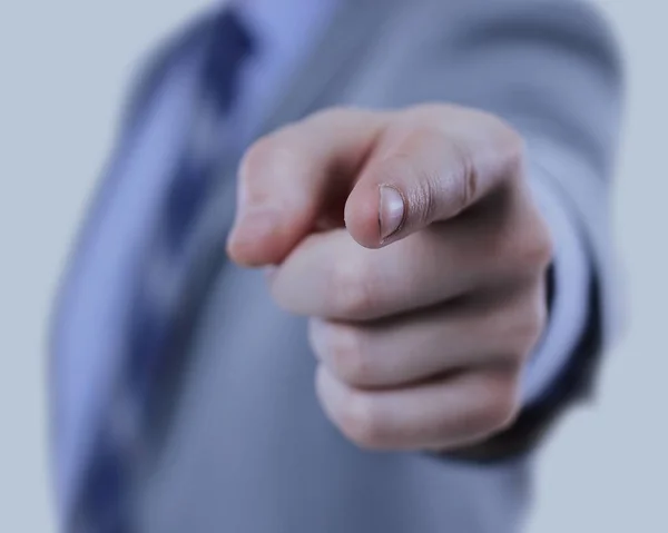 Ο άνθρωπος των επιχειρήσεων σε ένα κοστούμι που δείχνει με το δάχτυλό του — Φωτογραφία Αρχείου