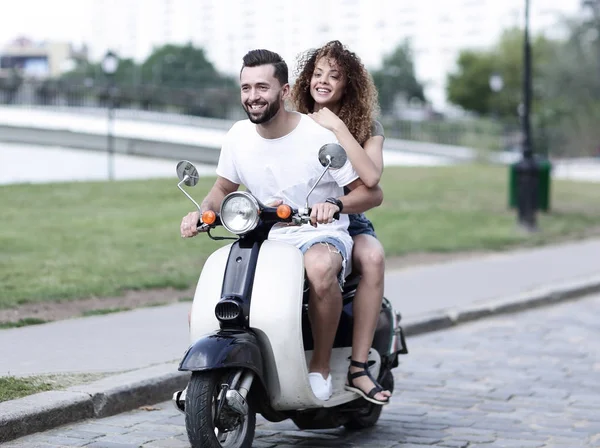 Happy cheerful couple riding vintage scooter. Travel concept. — Stock Photo, Image