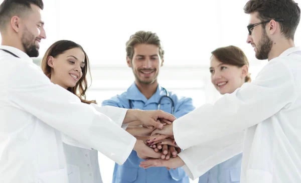 Doctors and nurses stacking hands. concept of mutual aid. — Stock Photo, Image