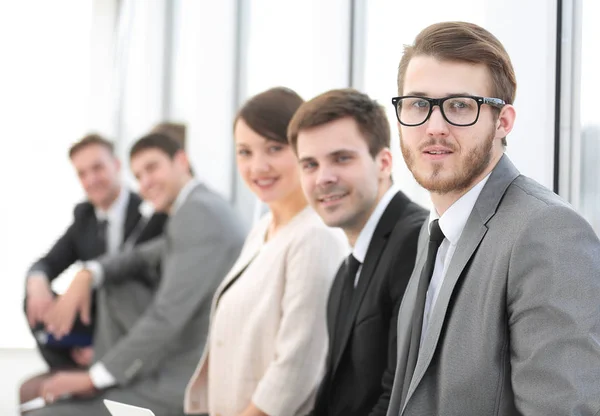 Group of business people in office lobby — Stock Photo, Image