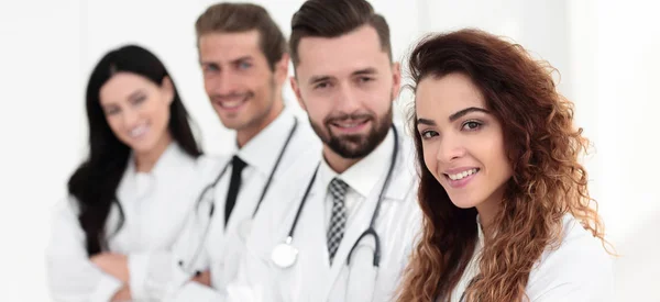 Portrait of female doctors with colleagues — Stock Photo, Image