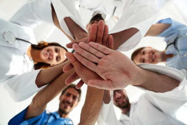 Bottom view. close up of a doctors folded their hands together — Stock Photo, Image