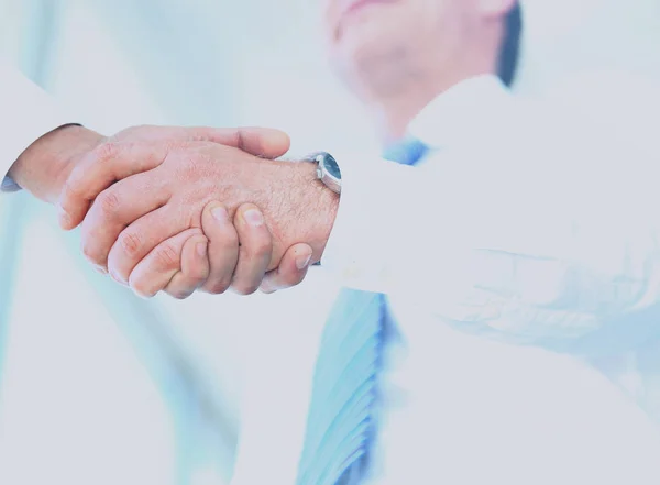 Low angle-shot of shake hands — Stock Photo, Image