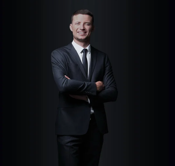 Bello uomo d'affari sorridente su sfondo nero — Foto Stock
