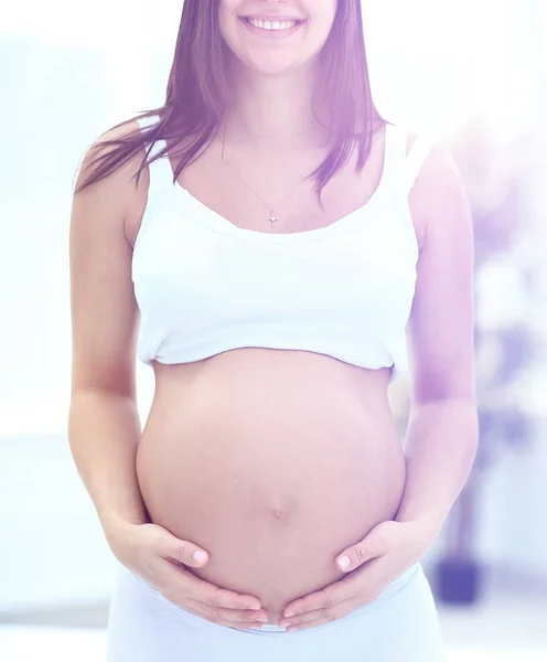 Mulher grávida sorrindo — Fotografia de Stock