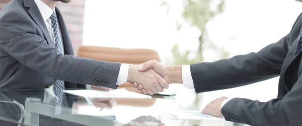 handshake of business partners on business negotiations