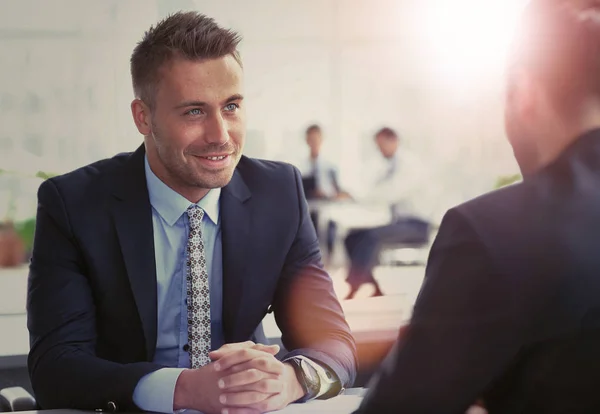 Image of smart businessman explaining new strategy to his partner at meeting — Stock Photo, Image