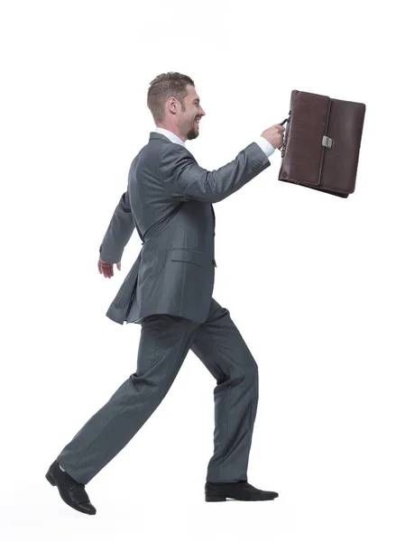 Lado view.cheerful hombre de negocios con maletín dando un paso adelante — Foto de Stock