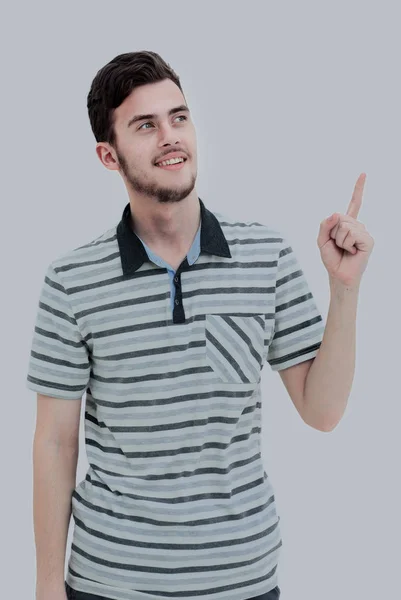 Jongeman wijzend op iets met zijn vinger — Stockfoto