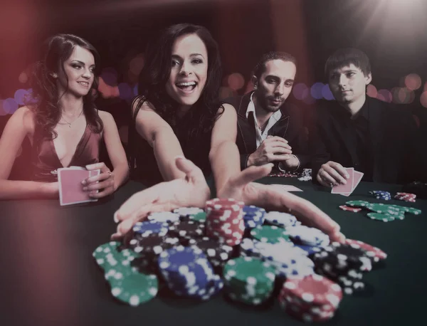 Young beautiful woman playing in casino — Stock Photo, Image