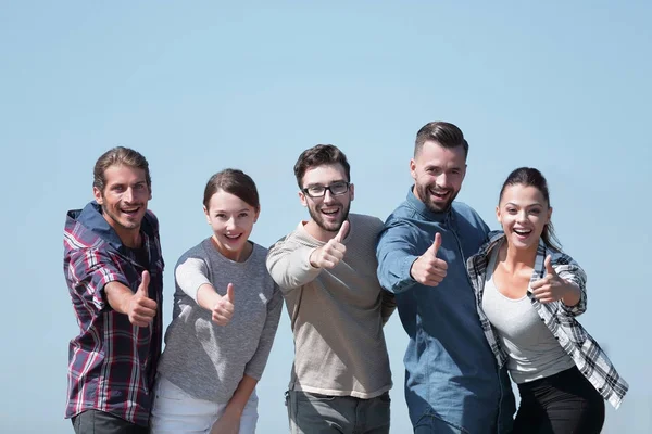 Smiling group of young people showing thumb up. — Stock Photo, Image