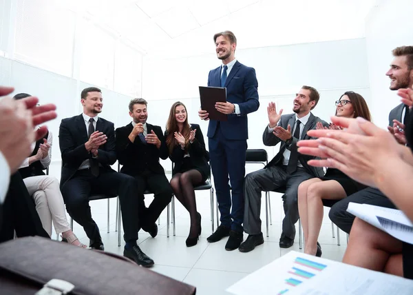 business team applauding the coach