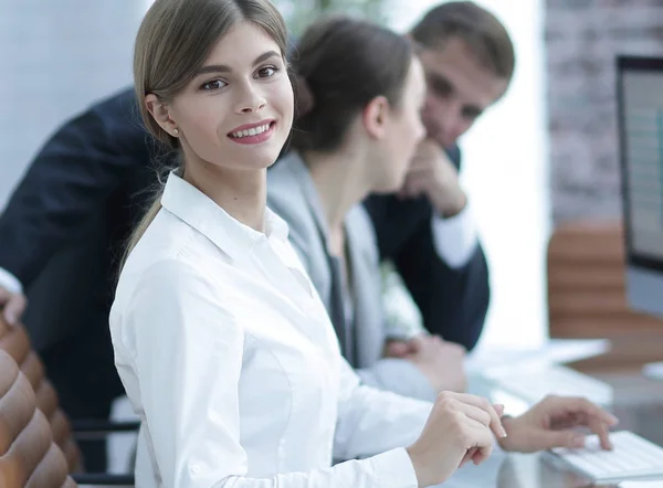 Young employee sitting at a Desk — Stock Photo, Image