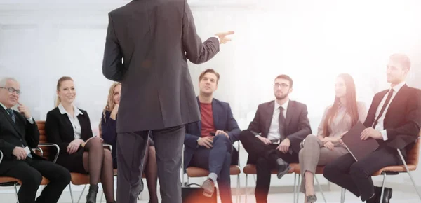 Member of the business team asks a question to the speaker at a — Stock Photo, Image