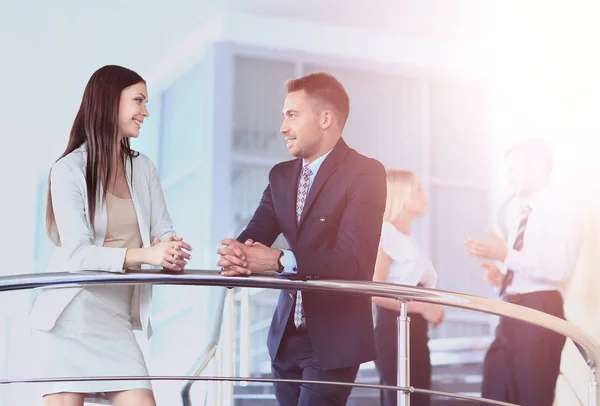 Business partners discussing while on the stairs — Stock Photo, Image