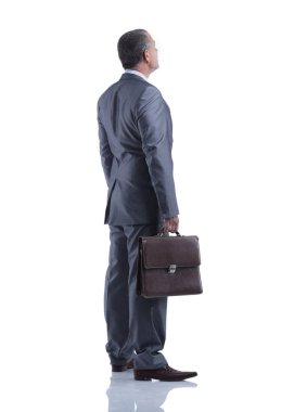 tam growth.rear görünümünde. boş ekrana bakarak işadamı