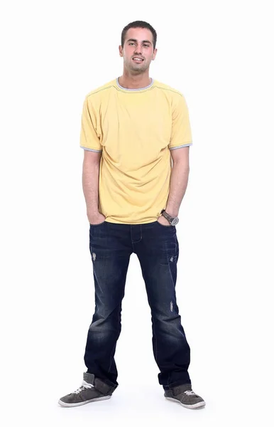 Young man in a yellow t-shirt and jeans. — Stock Photo, Image