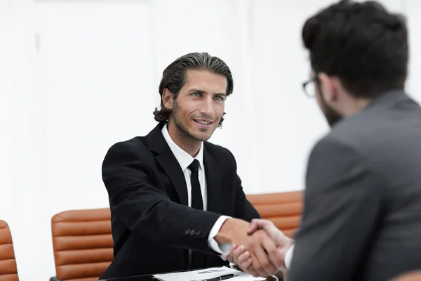 handshake Manager and the client sitting in the office