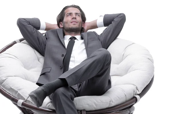 Businessman resting in a comfortable chair Stock Image