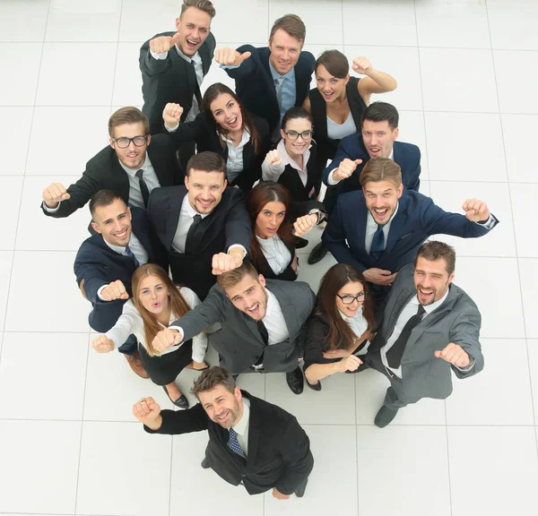 Concept of success. business team raising hands and looking at camera. — Stock Photo, Image