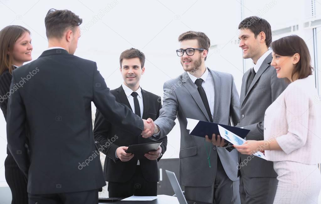 handshake of business partners before the financial transaction