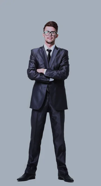 Jovem gerente está sorrindo isolado em fundo cinza — Fotografia de Stock
