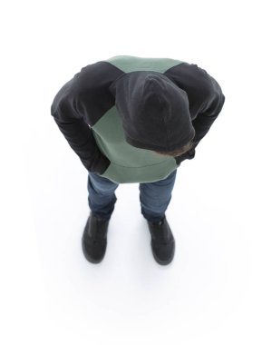 Yukarıdan görüntüleyin. Hipster aşağı bakıyor bir kukuleta ile ceket