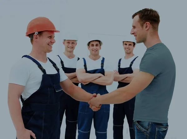 Cliente apertando as mãos com construtor — Fotografia de Stock