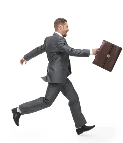 Side view.cheerful businessman with briefcase stepping forward — Stock Photo, Image