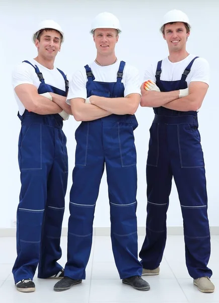 Successful construction workers standing with arms crossed — Stock Photo, Image